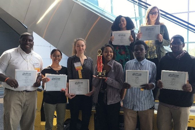 Culinary Arts students holding awards