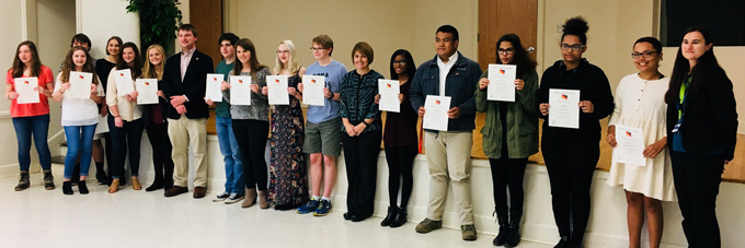 German Honor Society inductees holding membership certificates