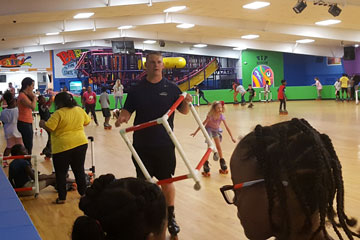 Students and adults roller skating