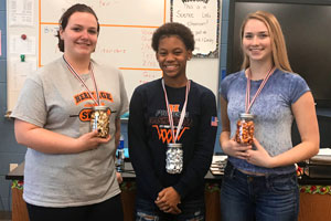 HHS Science Fair winners holding gold, silver and bronze "medals"