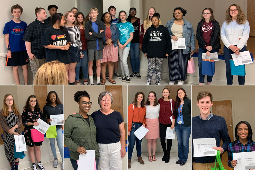 German Essay contest winners posing with certificates