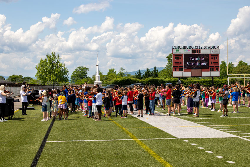 'Twinkle Variations' being played on the field at City Stadium during the 50th Annual Suzuki Festival