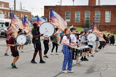 Drumline practicing outside on blacktop