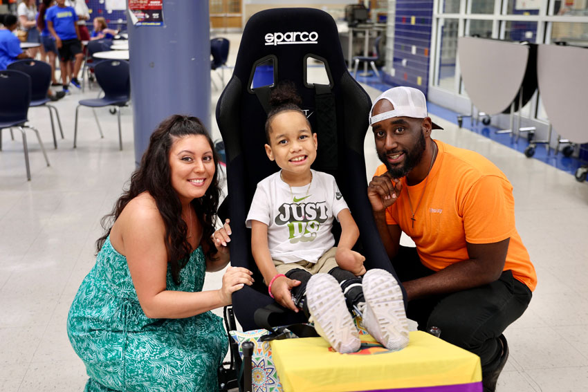 Parents with student in VR chair