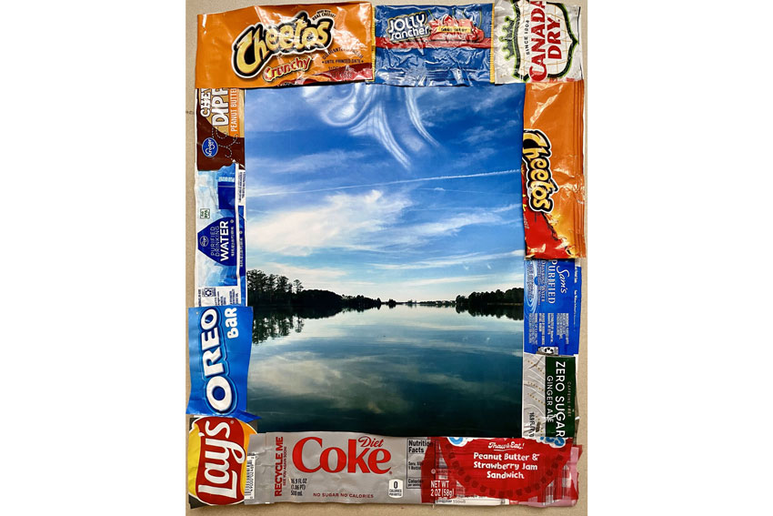 Mixed media art with food packaging and photo of body of water