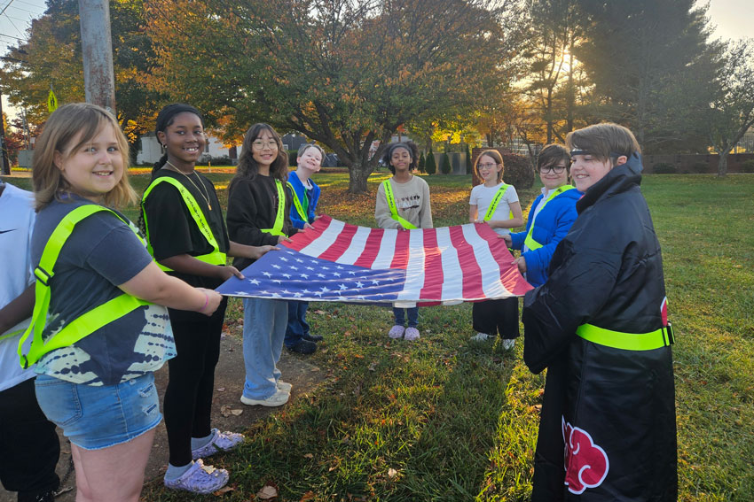 Students folding flag