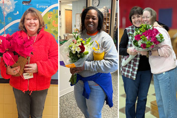 Three Teachers of the Year holding flowers